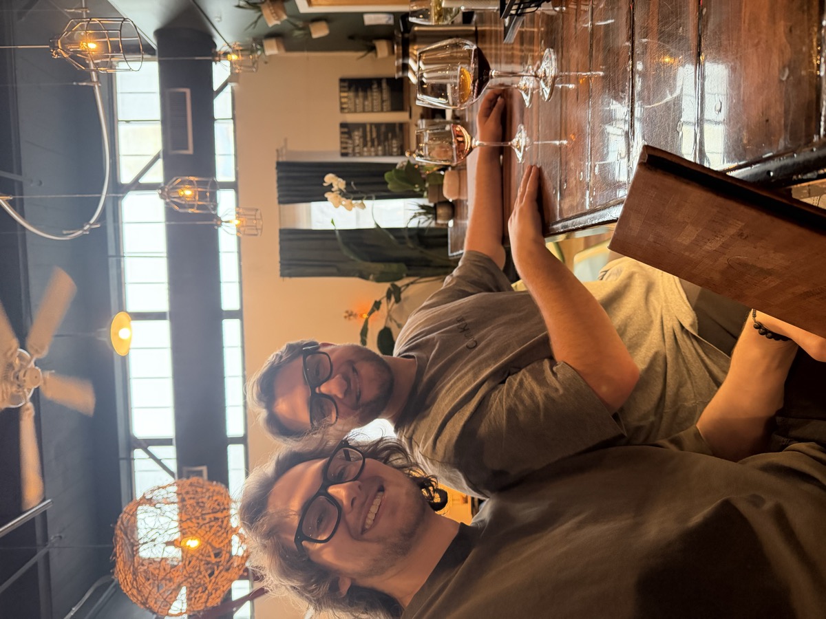 Eli Larkin at a wine bar with a friend